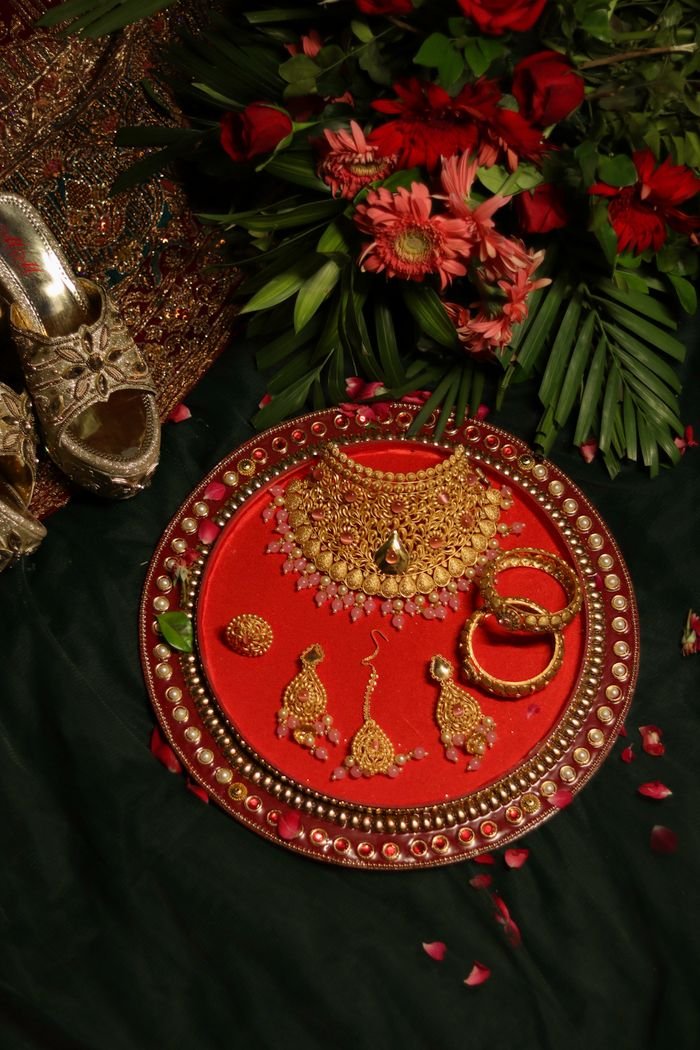 Luxurious traditional Indian jewelry set with floral accents, perfect for weddings or festive occasions.